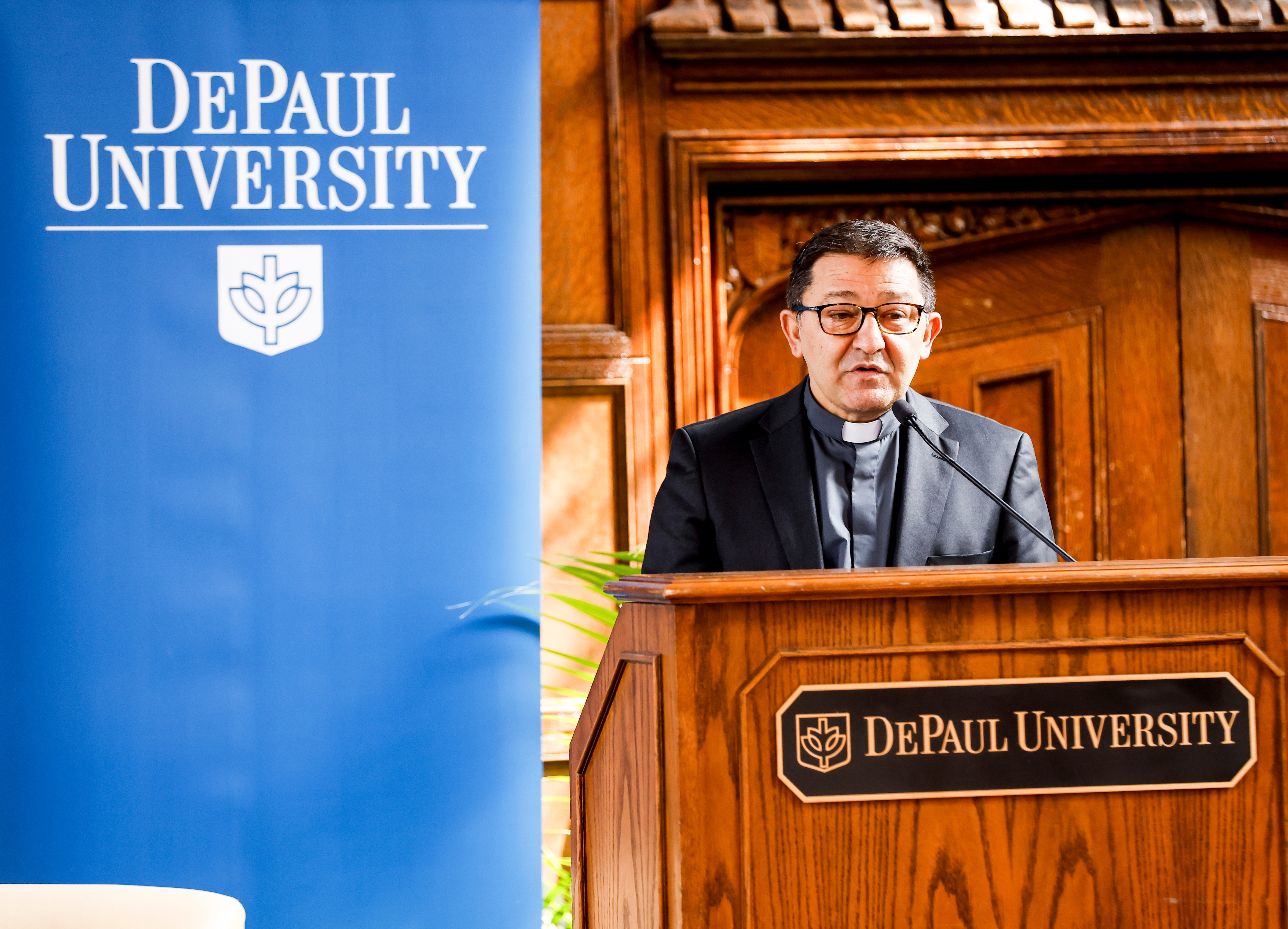 Rev. Guillermo Campuzano, C.M., vice-president for Mission and Ministry, opens the program with an invocation. (DePaul University/Steve Woltmann)